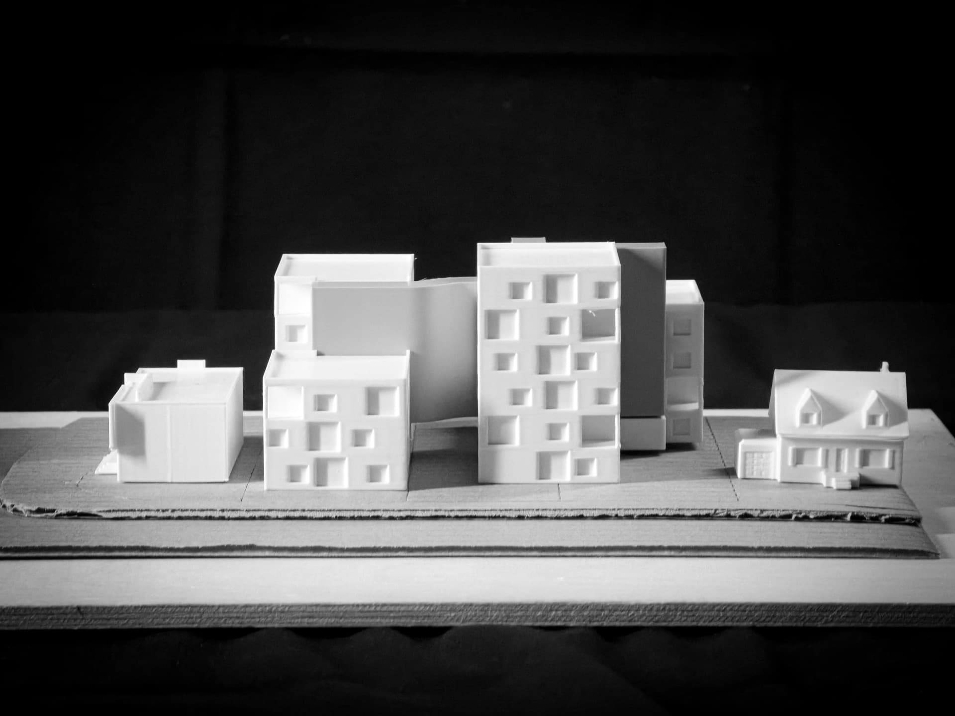 Sectional Study — White PLA sectional model revealing interior spatial relationships and circulation cores
